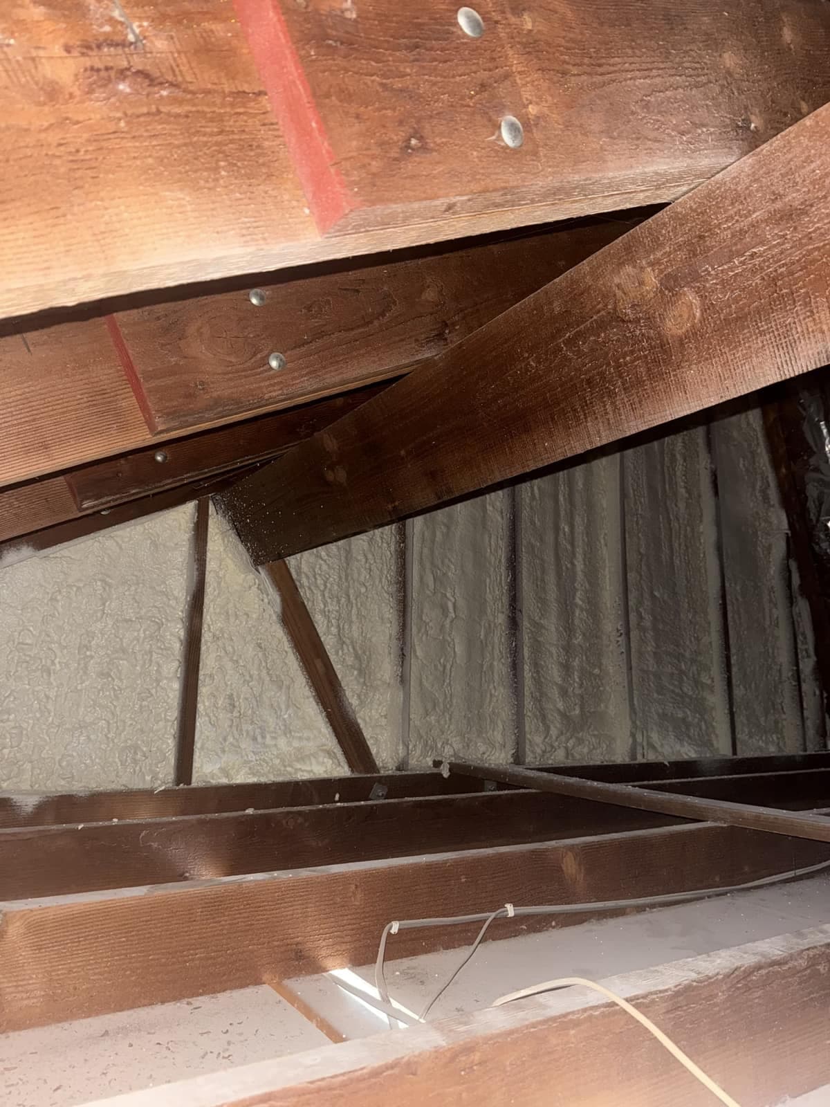 Spray foam applied to attic ceiling and rafters