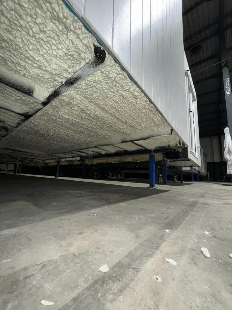 Spray foam insulation under modular home floor